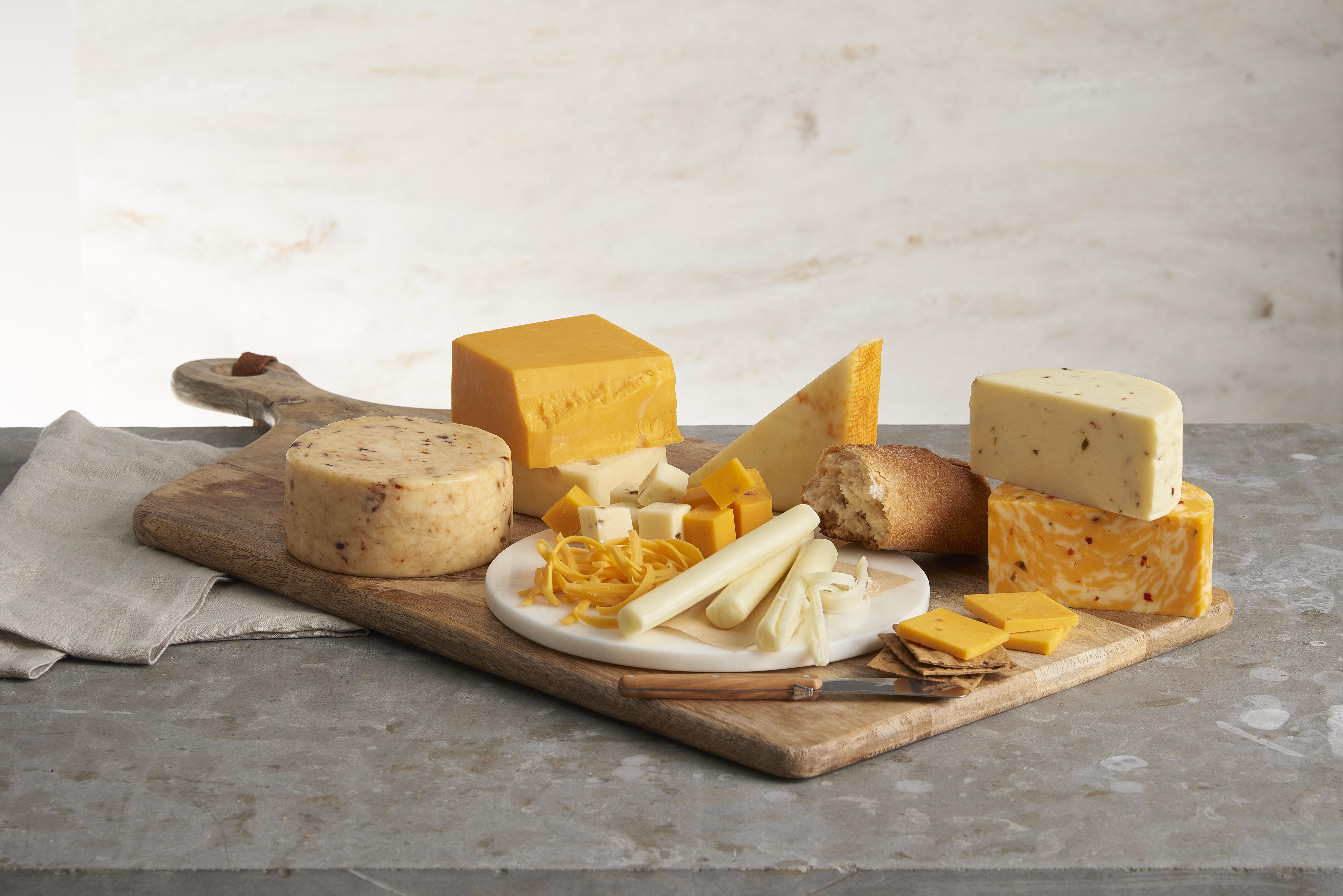 Selection of cheeses on a wooden board
